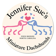 A circle with the name jennifer sue 's miniature dachshunds on it.